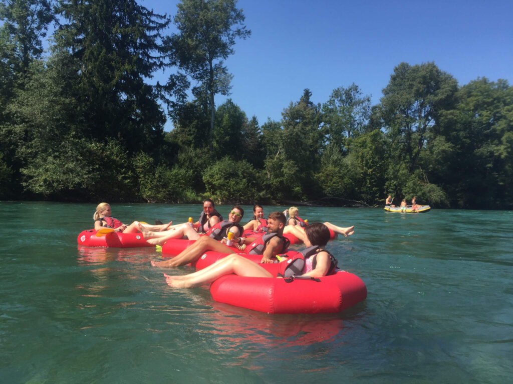 friends float river switzerland